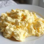 A close-up of perfectly creamy scrambled eggs, a great example for How to Make Egg Recipes Like a Pro.