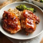 A plate featuring glazed chicken thighs served with brown rice and roasted broccoli, perfect for Easy Dinner Recipes in 25 Minutes.