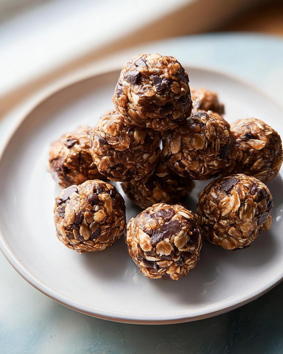 A stack of homemade oatmeal chocolate chip energy bites, a perfect addition to breakfast ideas recipes.