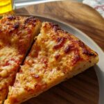 Two slices of homemade cheese pizza with bubbly, browned cheese, ready for The Only Pizza Night Recipes Recipe You’ll Need (2025).