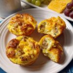 Four golden brown sausage and egg bites on a white plate, perfect for 20-Ingredient Breakfast Ideas Recipes.